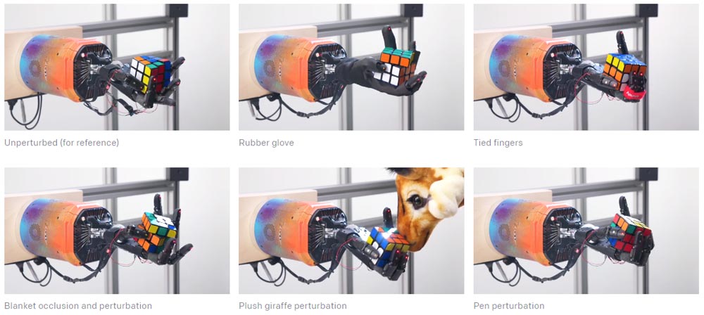Die automatisierte Randomisierung der Trainingsumgebung hat die Roboterhand-KI Dactyl robust gemacht gegen St&ouml;rungen. Selbst der hinterh&auml;ltige Angriff einer Pl&uuml;schgiraffe (Mitte unten) kann ihr nichs anhaben. Bild: OpenAI